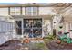 Cozy screened-in patio area with outdoor seating and direct access to the fenced backyard at 3557 Chestnut Dr. # 3557, Myrtle Beach, SC 29577