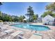 Inviting community pool surrounded by lounge chairs and lush landscaping at 3557 Chestnut Dr. # 3557, Myrtle Beach, SC 29577