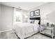 Charming bedroom featuring a window and a mirrored nightstand with a lamp at 375 Myrtle Meadows Dr # 417A, Conway, SC 29526