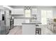 A modern kitchen features a large island with seating, stainless steel appliances, and access to the dining area at 375 Myrtle Meadows Dr # 417A, Conway, SC 29526