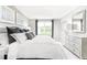 Comfortable main bedroom featuring a plush bed, dresser, and a large window with neutral carpeting at 375 Myrtle Meadows Dr # 417A, Conway, SC 29526