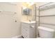 Clean bathroom featuring a white vanity, mirror, and shelving, offering a functional space at 3762 Citation Way # 1013, Myrtle Beach, SC 29577