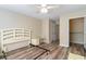 Another angle of the bedroom showcases a closet and natural light from the window, laminate floors at 3762 Citation Way # 1013, Myrtle Beach, SC 29577
