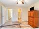 Spacious bedroom with wood-look floors leading to en-suite bathroom at 3762 Citation Way # 1013, Myrtle Beach, SC 29577