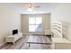 Spacious bedroom with a ceiling fan, laminate floors and natural light from the window at 3762 Citation Way # 1013, Myrtle Beach, SC 29577