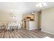 Open-concept dining area with wood-look floors, a ceiling fan and access to the kitchen at 3762 Citation Way # 1013, Myrtle Beach, SC 29577