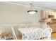 Dining space featuring white chairs, wood-look floors and a partial view of kitchen at 3762 Citation Way # 1013, Myrtle Beach, SC 29577