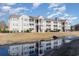 The apartment building is reflected in the stream, showcasing beautiful architecture at 3762 Citation Way # 1013, Myrtle Beach, SC 29577