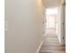 Well-lit hallway featuring wood-look flooring and neutral-colored walls at 3762 Citation Way # 1013, Myrtle Beach, SC 29577