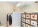 A laundry room featuring a modern washer and dryer, along with a storage system at 3762 Citation Way # 1013, Myrtle Beach, SC 29577