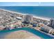Aerial view of oceanfront real estate, canal, and beach showing coastal community at 4103 N Ocean Blvd. # 207, North Myrtle Beach, SC 29582