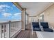 Inviting condo balcony with comfortable seating overlooking the stunning ocean view at 4103 N Ocean Blvd. # 207, North Myrtle Beach, SC 29582