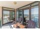 Balcony with Adirondack chairs providing scenic ocean views and sliding glass door entry at 4103 N Ocean Blvd. # 207, North Myrtle Beach, SC 29582