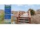 Direct beach access walkway with signage for community regulations and rules at 4103 N Ocean Blvd. # 207, North Myrtle Beach, SC 29582