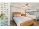 Shared bedroom featuring a full bed, a twin-over-twin bunk bed, and modern decor at 4103 N Ocean Blvd. # 207, North Myrtle Beach, SC 29582