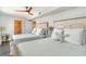 Bright bedroom featuring two beds with coastal accents and a ceiling fan at 4103 N Ocean Blvd. # 207, North Myrtle Beach, SC 29582