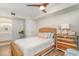 Comfortable bedroom features a light colored bed and a colorful dresser, plus access to an ensuite bathroom at 4103 N Ocean Blvd. # 207, North Myrtle Beach, SC 29582