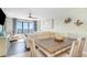 Dining room and living room combination with great ocean views through the window at 4103 N Ocean Blvd. # 207, North Myrtle Beach, SC 29582