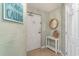 Hallway with a table and a wood mirror and sign that says The Beach is Calling at 4103 N Ocean Blvd. # 207, North Myrtle Beach, SC 29582