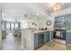 Open-concept kitchen with barstool seating, stainless steel appliances, and ocean views at 4103 N Ocean Blvd. # 207, North Myrtle Beach, SC 29582