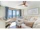Living room with view of the ocean, an armchair, and a large white couch at 4103 N Ocean Blvd. # 207, North Myrtle Beach, SC 29582