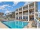Relaxing community pool surrounded by lounge chairs and offering a refreshing outdoor space at 4103 N Ocean Blvd. # 207, North Myrtle Beach, SC 29582