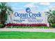 Entrance sign to Ocean Creek Plantation advertising vacation rentals and conference center at 415 Ocean Creek Dr. # 2202, Myrtle Beach, SC 29572