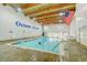 Bright indoor pool with high wooden ceilings, large lettering that says Ocean Creek, and an American flag at 415 Ocean Creek Dr. # 2202, Myrtle Beach, SC 29572