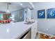 Well-appointed kitchen featuring quartz countertops, stainless steel appliances, and an open design connected to the dining area at 415 Ocean Creek Dr. # 2202, Myrtle Beach, SC 29572