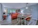 Open-concept living and dining area with wood floors and access to a private balcony at 415 Ocean Creek Dr. # 2202, Myrtle Beach, SC 29572