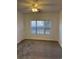Bedroom featuring neutral carpet, a window providing natural light, and a ceiling fan at 4155 Hibiscus Dr. # 103, Little River, SC 29566