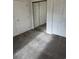 Bedroom featuring a mirrored closet, neutral carpeting, and white doors at 4155 Hibiscus Dr. # 103, Little River, SC 29566