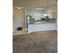 Open kitchen with granite countertops, stainless steel appliances, white cabinetry, and tiled backsplash at 4155 Hibiscus Dr. # 103, Little River, SC 29566