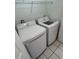 Efficient laundry room featuring a stacked washer and dryer, maximizing space and convenience at 4155 Hibiscus Dr. # 103, Little River, SC 29566