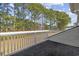 Balcony overlooking line of tall pine trees and green space at 437 Colonial Trace Dr. # 2C, Longs, SC 29568