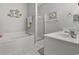 Well-lit bathroom featuring a soaking tub, glass enclosed shower, and vanity at 437 Colonial Trace Dr. # 2C, Longs, SC 29568