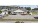 Exterior view of the clubhouse with ample parking at 437 Colonial Trace Dr. # 2C, Longs, SC 29568