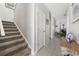 Hallway with carpeted stairs and tile flooring leading to other rooms at 437 Colonial Trace Dr. # 2C, Longs, SC 29568
