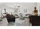 Bright living room features neutral tones, ceiling fan, large sectional, and decorative area rug at 437 Colonial Trace Dr. # 2C, Longs, SC 29568
