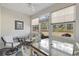 Cozy sun room with a view of a well-landscaped backyard, neutral color palette, and plenty of light at 437 Colonial Trace Dr. # 2C, Longs, SC 29568