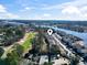Aerial view of community with a golf course, waterfront access, and scenic surroundings at 4420 Eastport Blvd. # M12, Little River, SC 29566