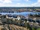 Aerial view of waterfront condos nestled along a scenic waterway at 4420 Eastport Blvd. # M12, Little River, SC 29566