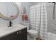 Bathroom featuring a modern vanity, toilet, shower with tub, and updated fixtures at 4420 Eastport Blvd. # M12, Little River, SC 29566