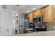 Modern kitchen with stackable washer/dryer, stainless steel appliances, and ample storage at 4420 Eastport Blvd. # M12, Little River, SC 29566