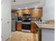 Functional kitchen with stainless steel appliances, wood cabinets, and a convenient layout at 4420 Eastport Blvd. # M12, Little River, SC 29566