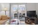 Living room flows out to a cozy porch complete with woven furniture set at 4420 Eastport Blvd. # M12, Little River, SC 29566