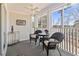 Cozy screened porch features wicker seating, ceiling fan, and view of the outdoor surroundings at 4420 Eastport Blvd. # M12, Little River, SC 29566