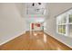 Spacious living room featuring high ceilings, hardwood floors, and natural light at 46 Pembroke Ln. # 46, Pawleys Island, SC 29585