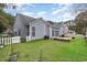 Home exterior showing a well-maintained backyard with a white picket fence at 481 Morning Glory Ct., Myrtle Beach, SC 29579