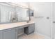 Bathroom vanity features a large mirror, ample counter space, and a gray cabinet at 481 Morning Glory Ct., Myrtle Beach, SC 29579